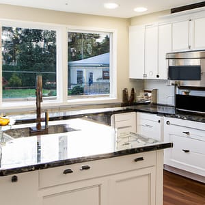 An image showcasing the transformation of a dull, outdated kitchen into a stunning, modern space
