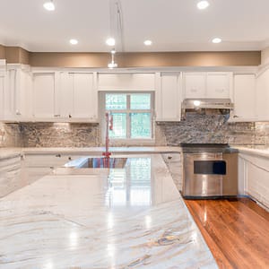An image showcasing a modern, sleek kitchen and bathroom transformation